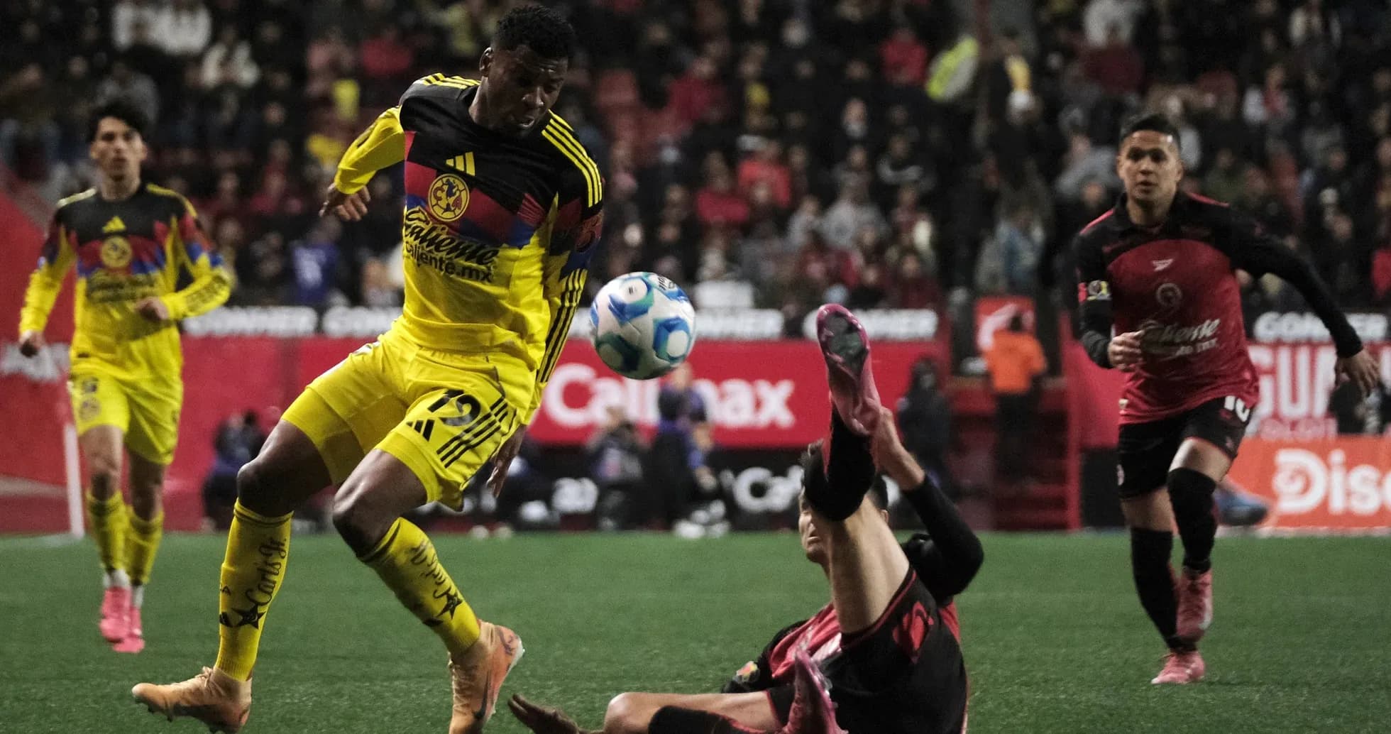 Club America player dribbling during Liga MX match