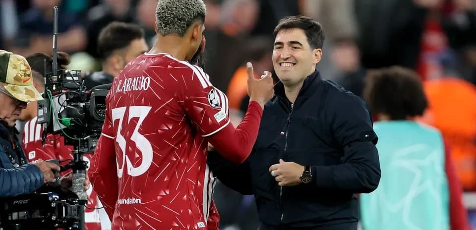 Player and coach interacting during match celebration