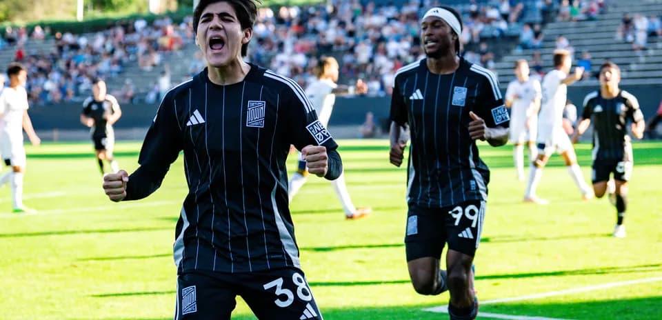 Players celebrating a goal during the match