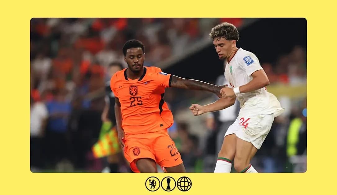 Players from Netherlands and Morocco competing for possession