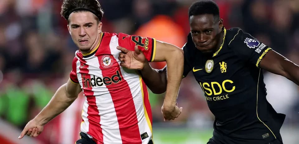 Brentford and Chelsea players competing for possession
