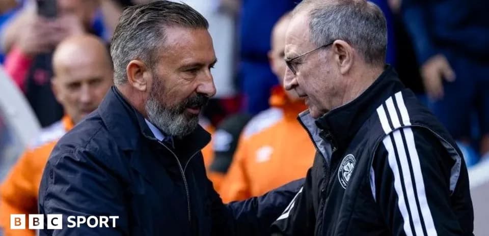 Two coaches shaking hands before the match