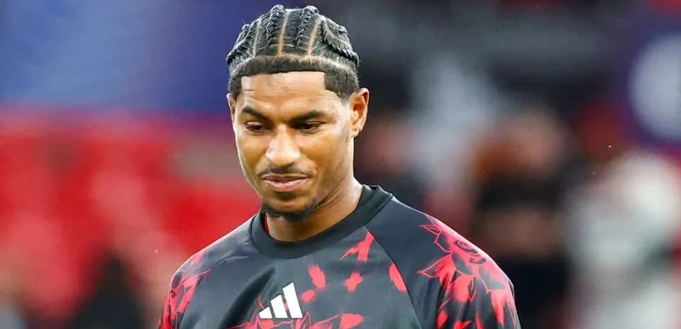 Player in Manchester United training kit on field