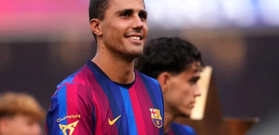 Player in FC Barcelona kit during trophy presentation
