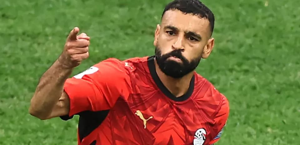 Player celebrating in Egypt national team jersey