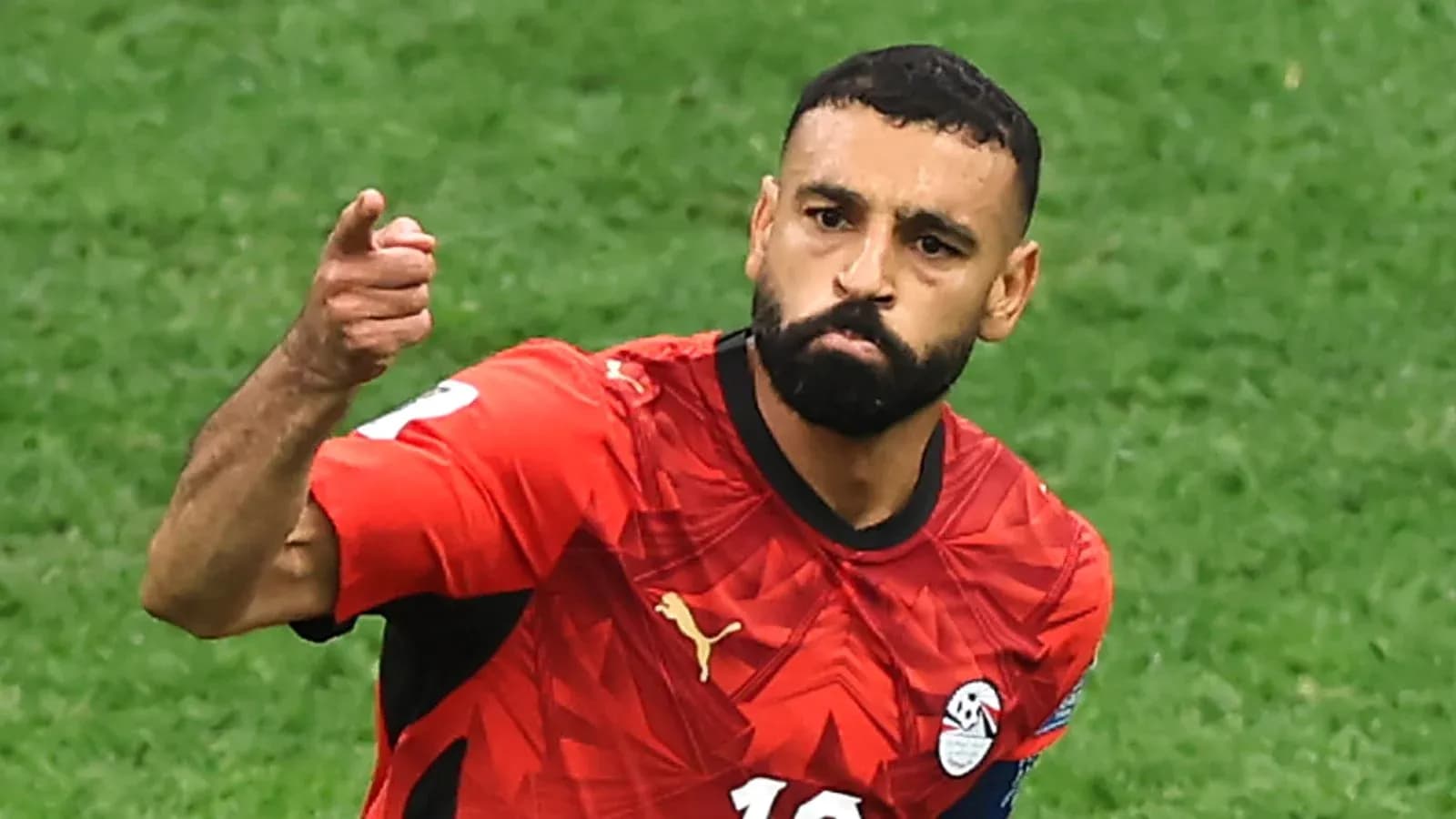Player celebrating in Egypt national team jersey