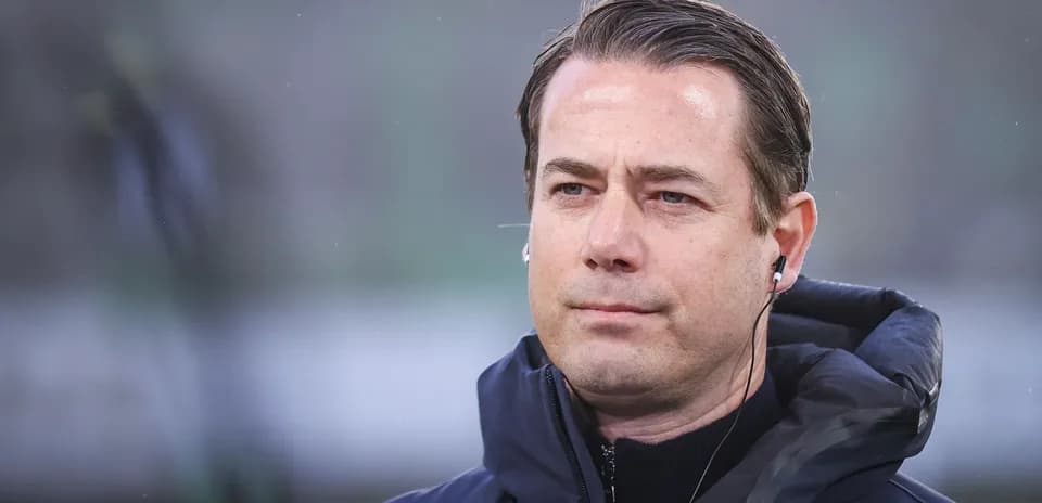 Coach wearing headphones during a match
