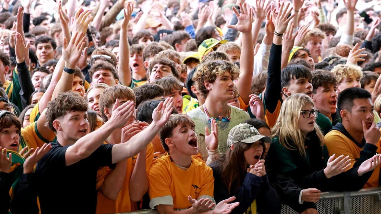 Crowd of fans cheering at a sports event