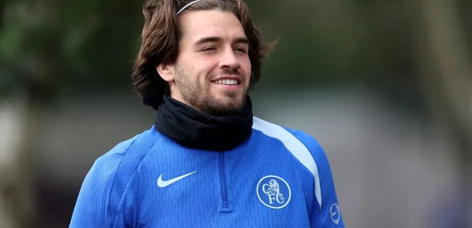 Player smiling during training session in blue kit