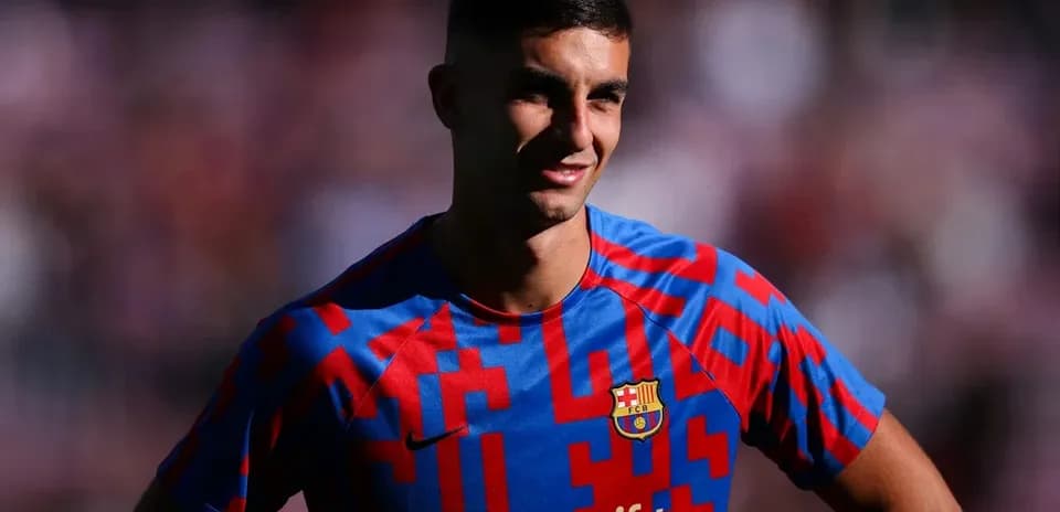 Player posing in Barcelona jersey before match