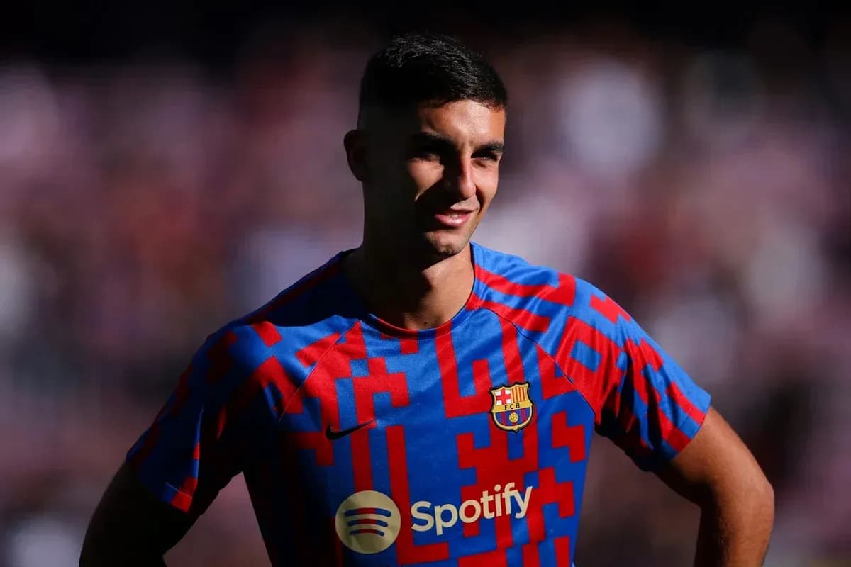 Player posing in Barcelona jersey before match