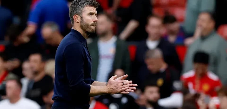 Coach gesturing during match at Old Trafford
