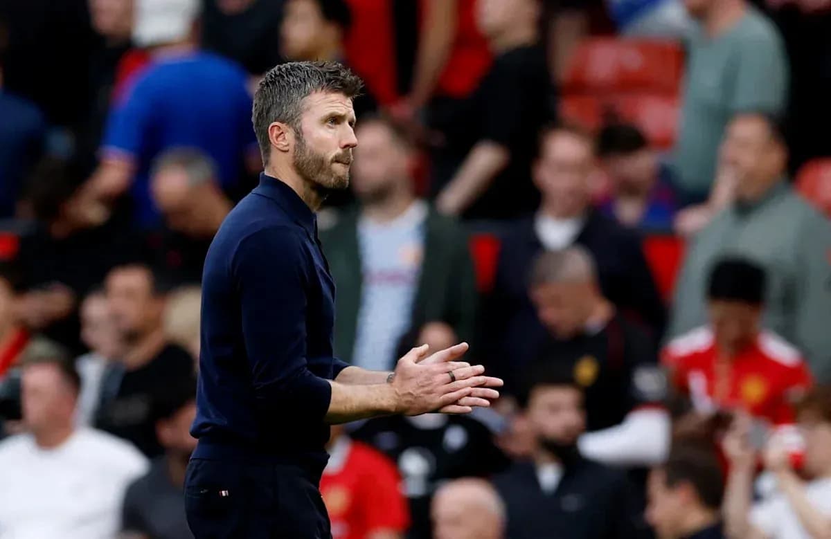 Coach gesturing during match at Old Trafford