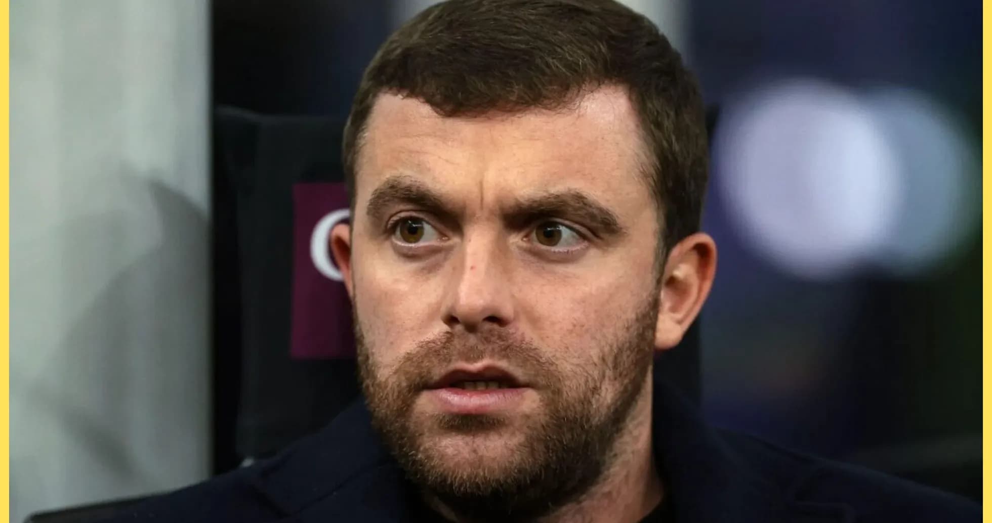 Close-up of a man with a beard looking concerned