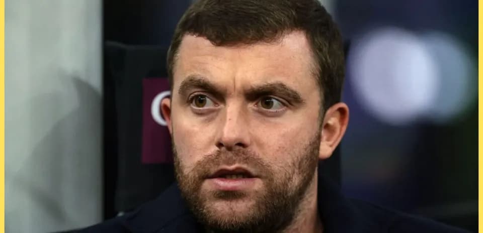 Close-up of a man with a beard looking concerned