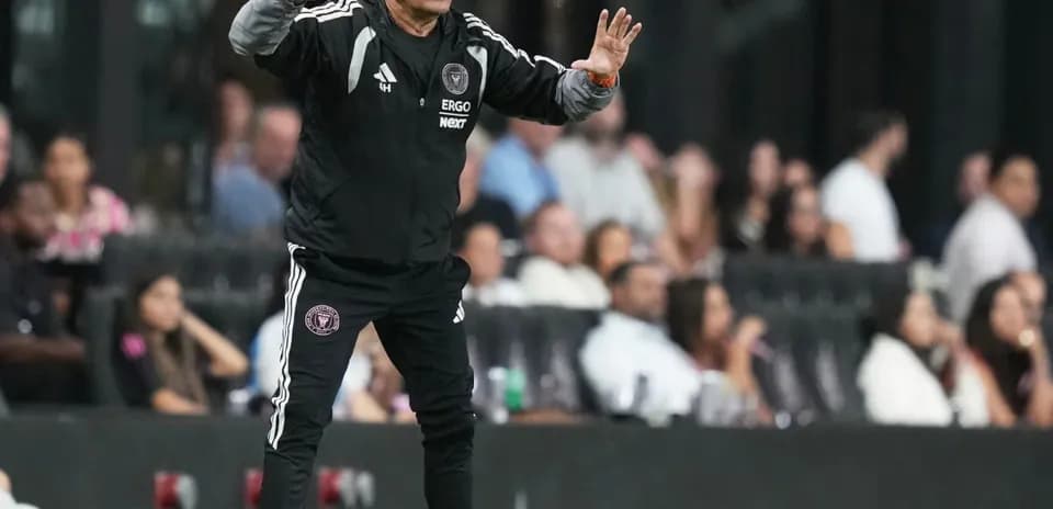 Coach directing players during a match on sidelines