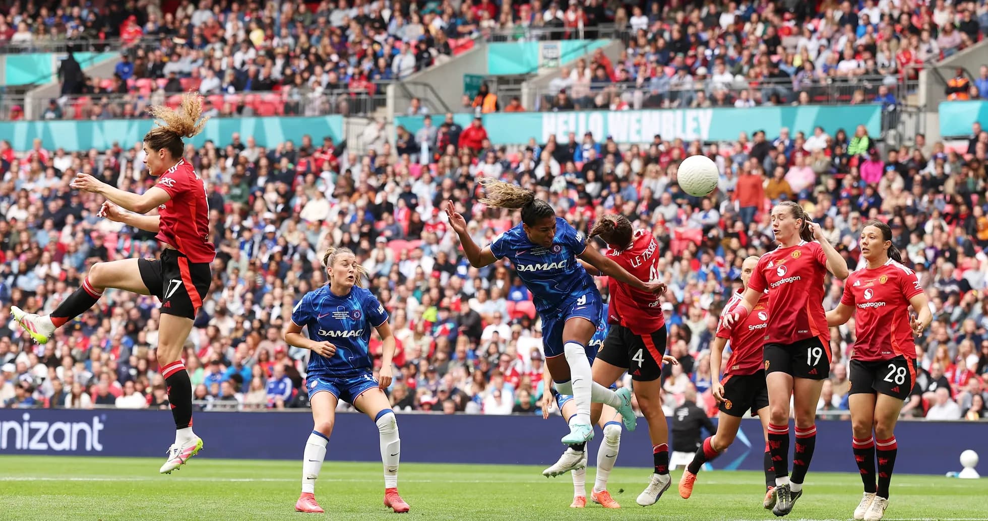 Players contesting for the ball during FA WSL match