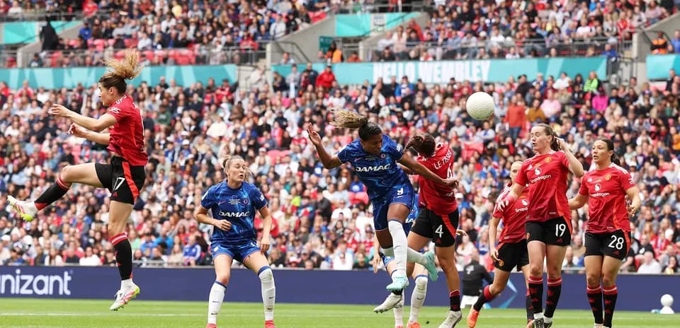 Players contesting for the ball during FA WSL match