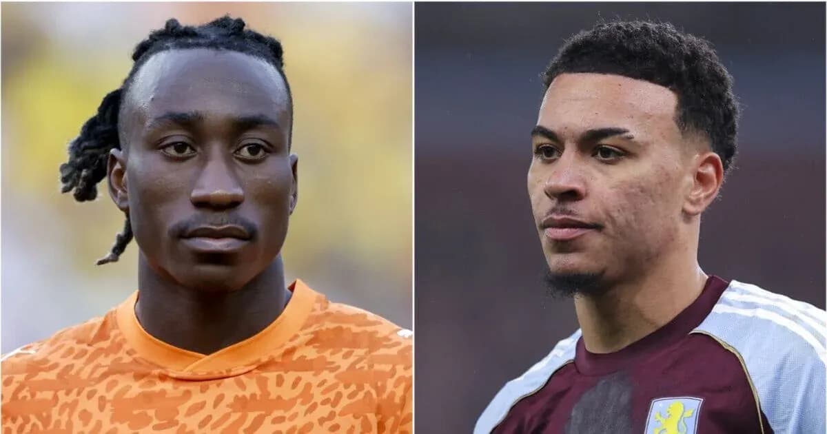 Two football players in match uniforms looking serious