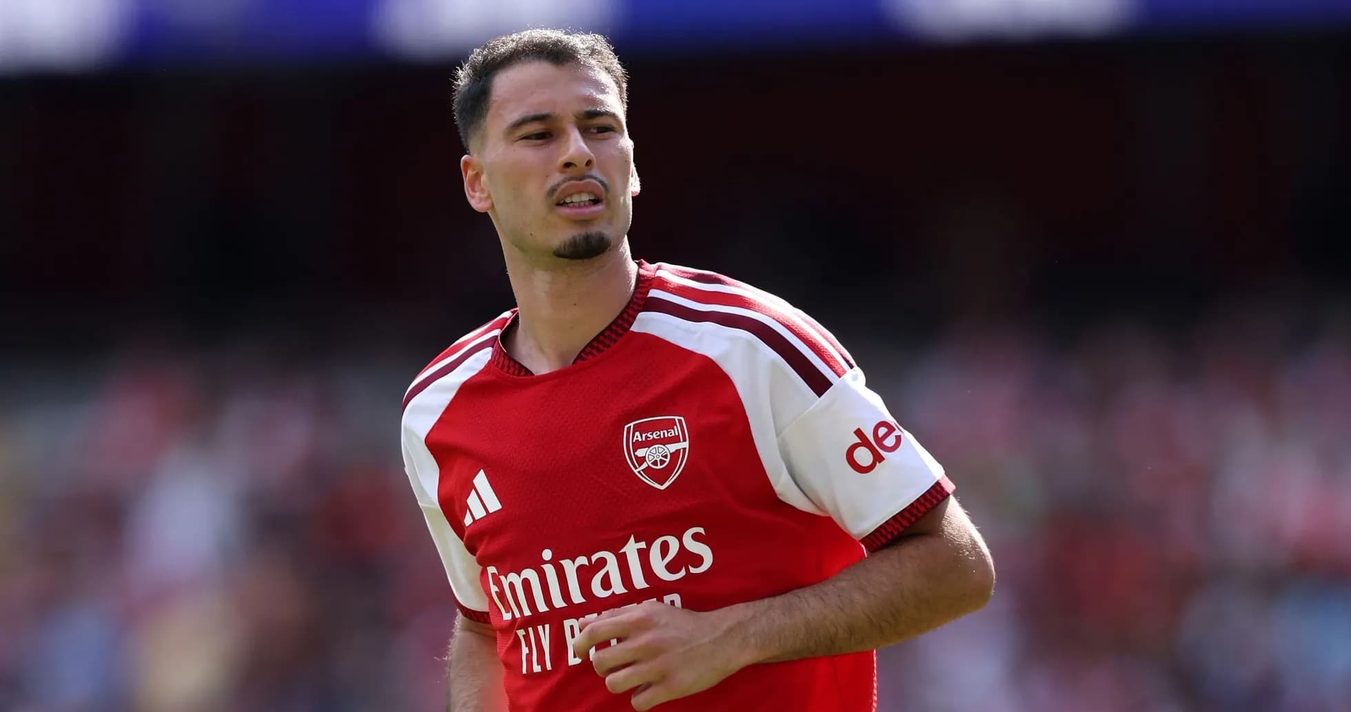 Player wearing Arsenal jersey during match