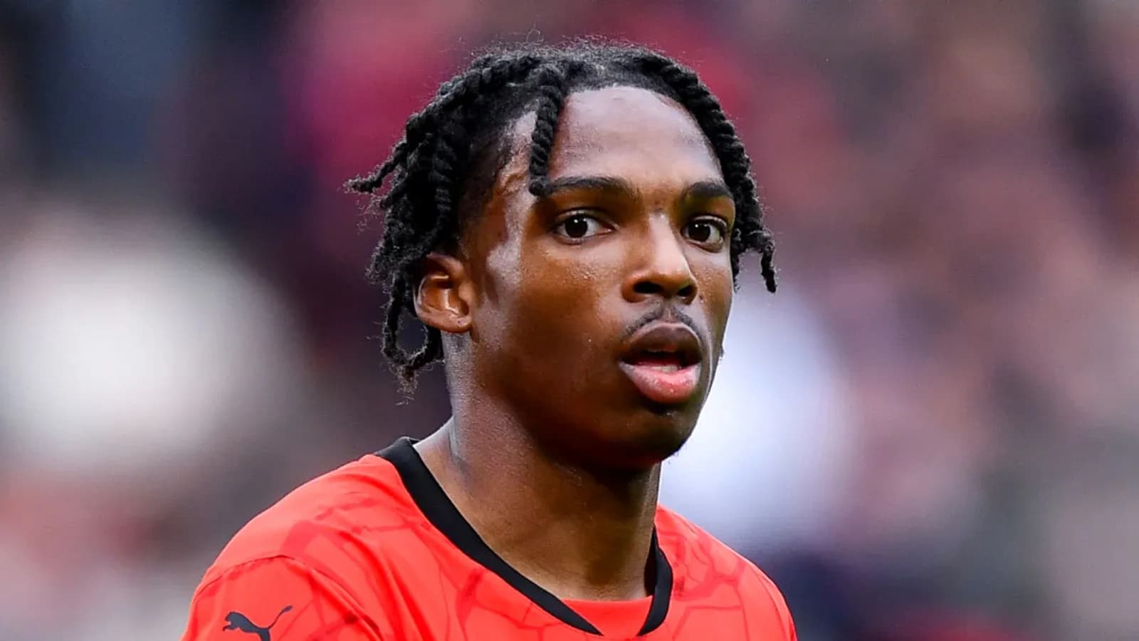 Player in red jersey during a match