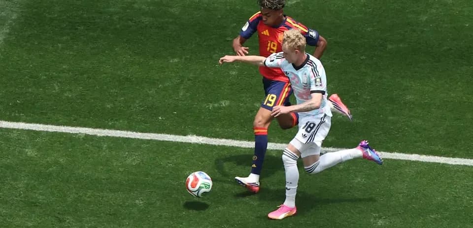 Players contesting the ball during a football match