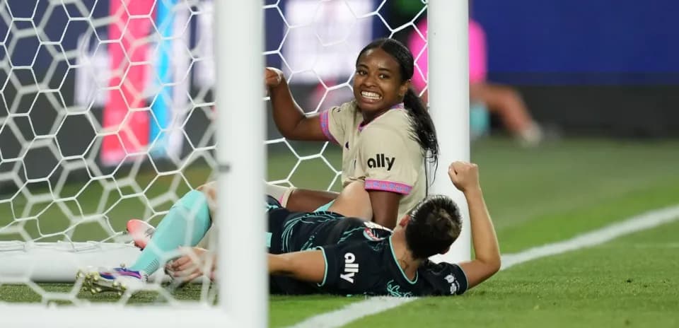 Players celebrating near the goal during match