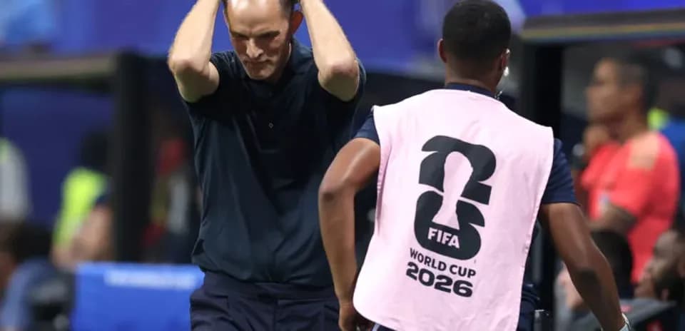 Coach with hands on head during match frustration