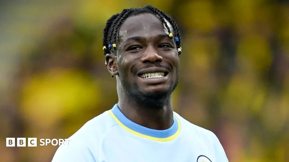 Player smiling during match warm-up on field
