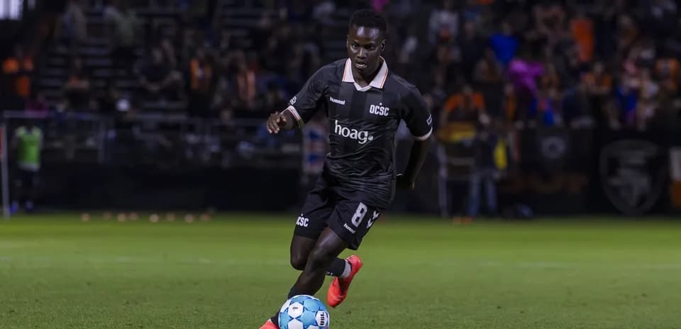 Player from Orange County SC dribbling the ball