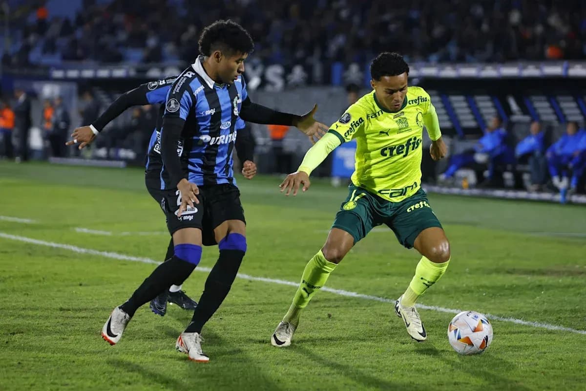 Two players contesting for the ball on the field