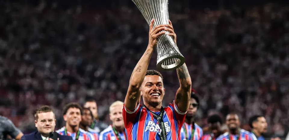 Player celebrating with trophy after winning match