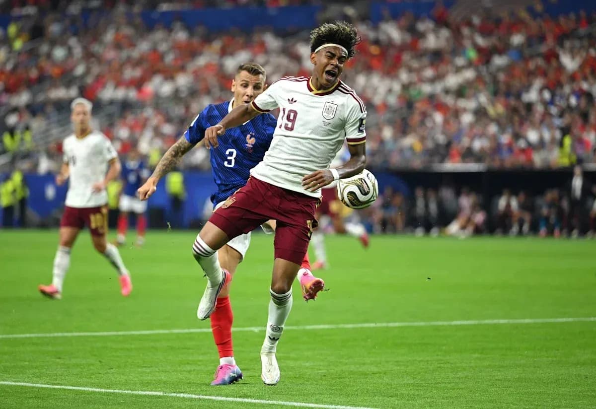 Player 19 of Spain evading tackle from French defender