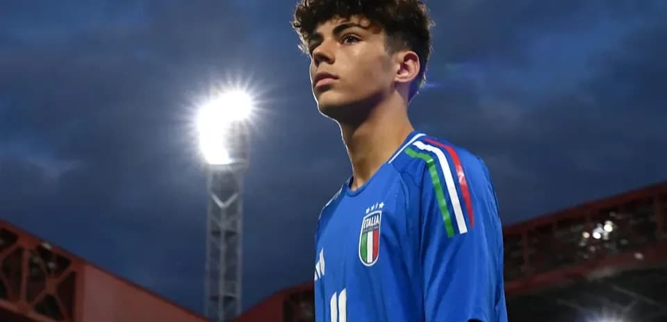 Young player in blue Italy jersey during match