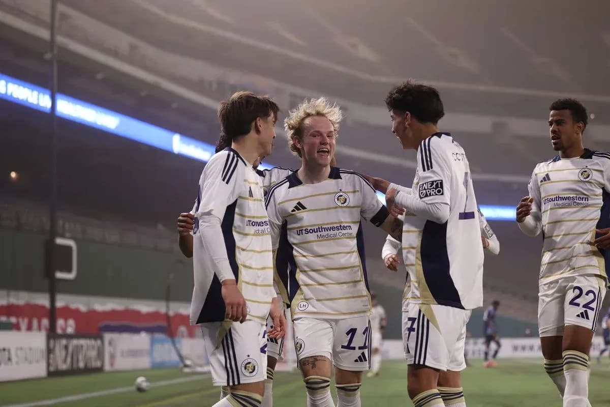 Players celebrating a goal during North Texas match