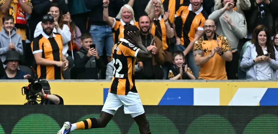Player celebrating in front of cheering crowd