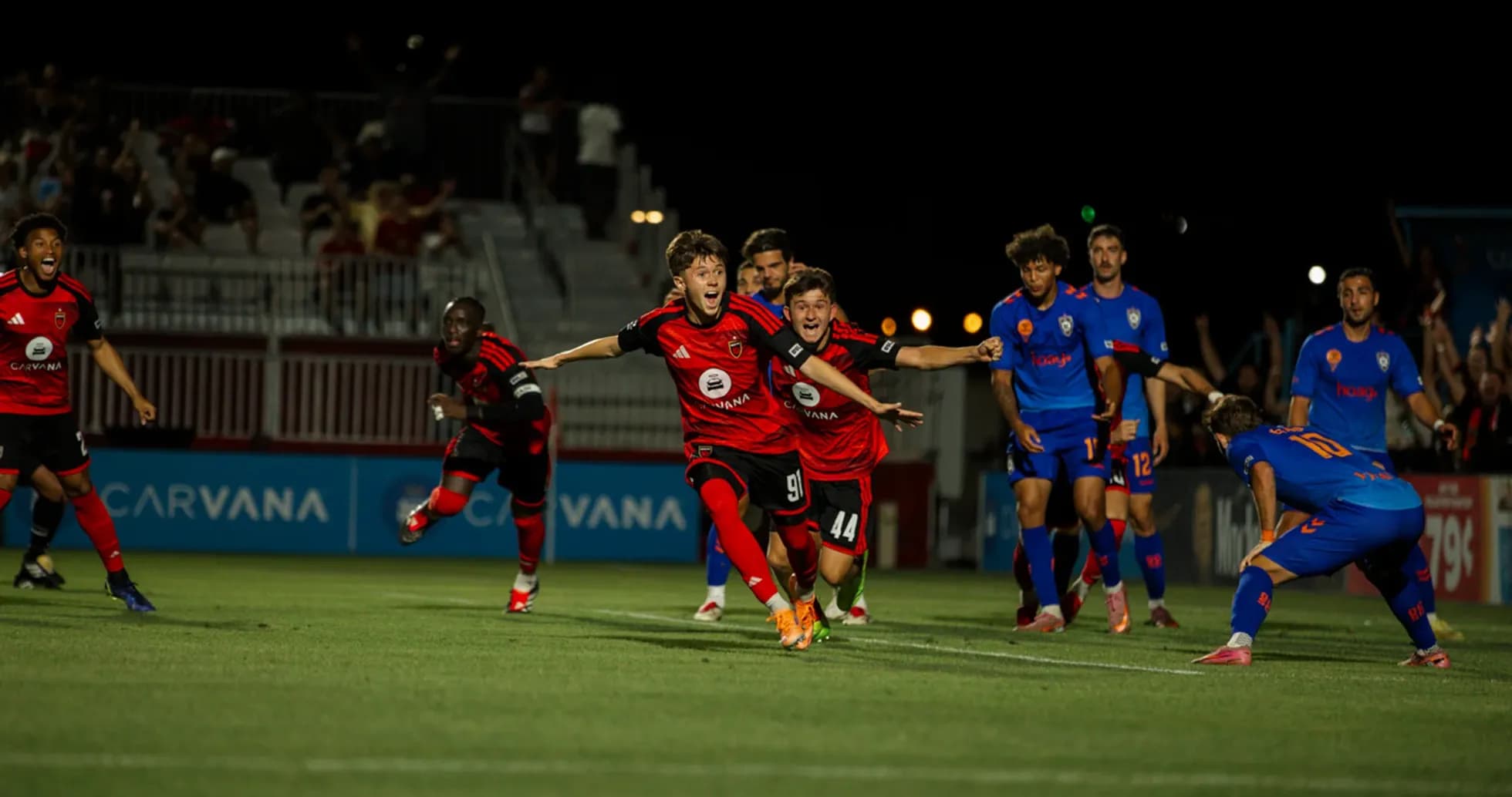 Players celebrating a goal during match