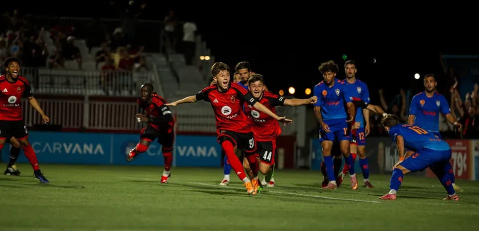 Players celebrating a goal during match