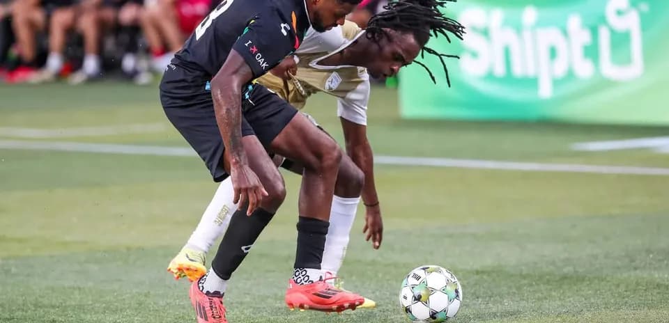 Players competing for the ball during match