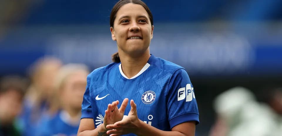 Player applauding during match warm-up at Stamford Bridge