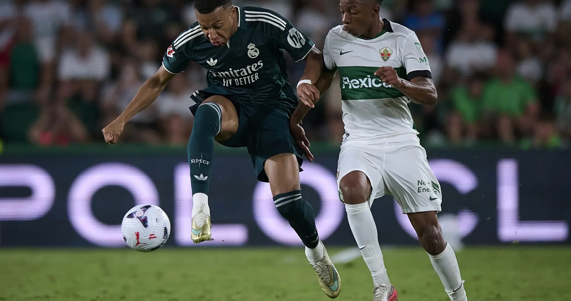 Mbappe challenging for the ball against Elche player