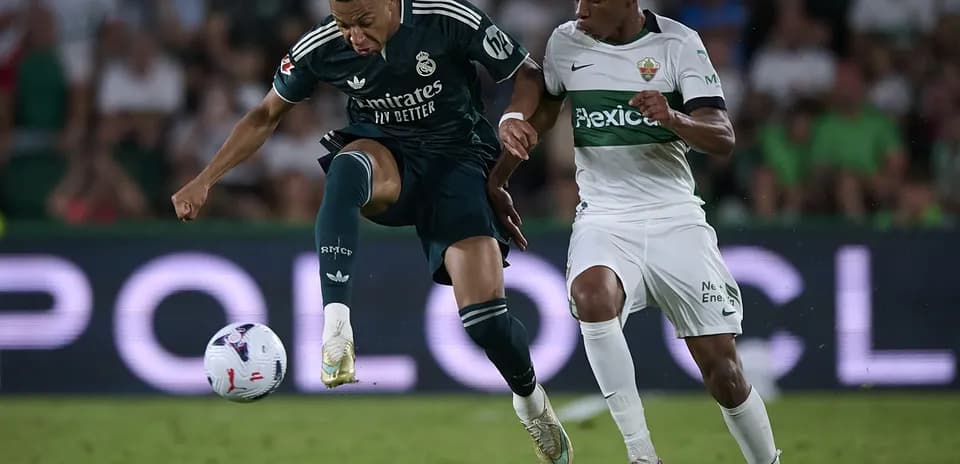 Mbappe challenging for the ball against Elche player