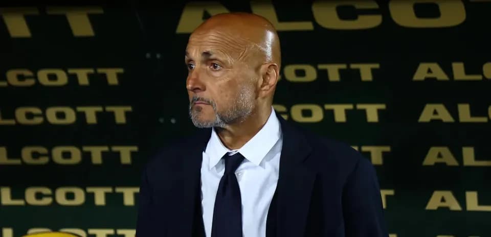 Coach standing on the sidelines during a match