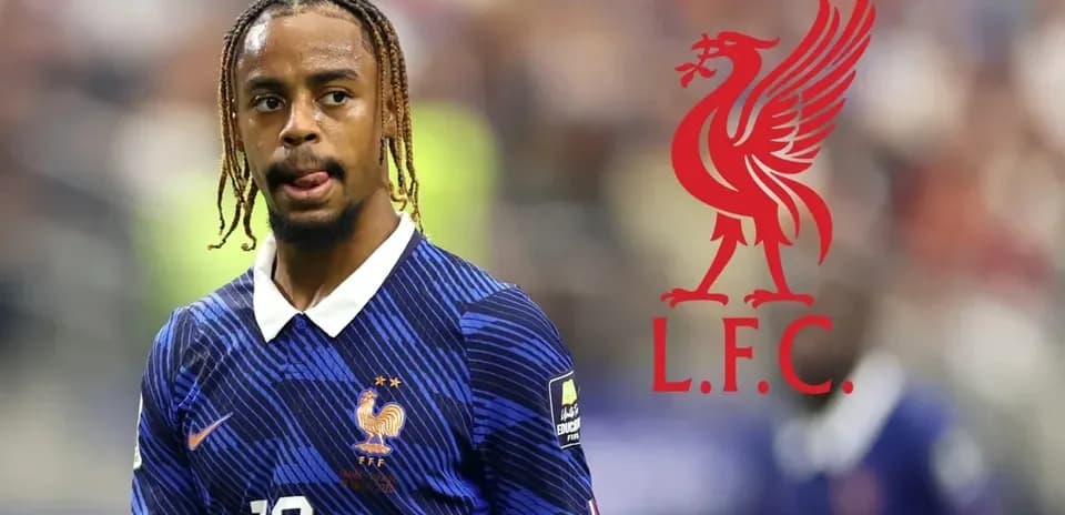 Player in France kit with Liverpool logo background