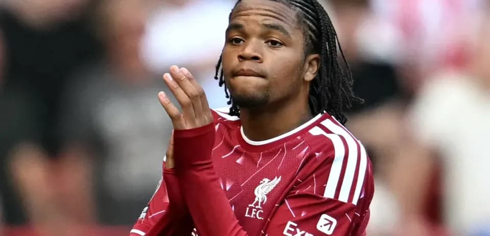 Player in Liverpool jersey clapping to crowd