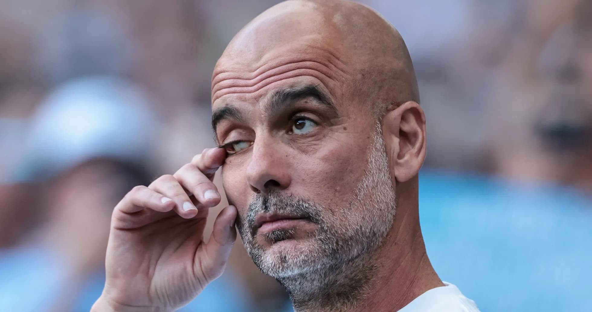 Coach touching his eye during a match