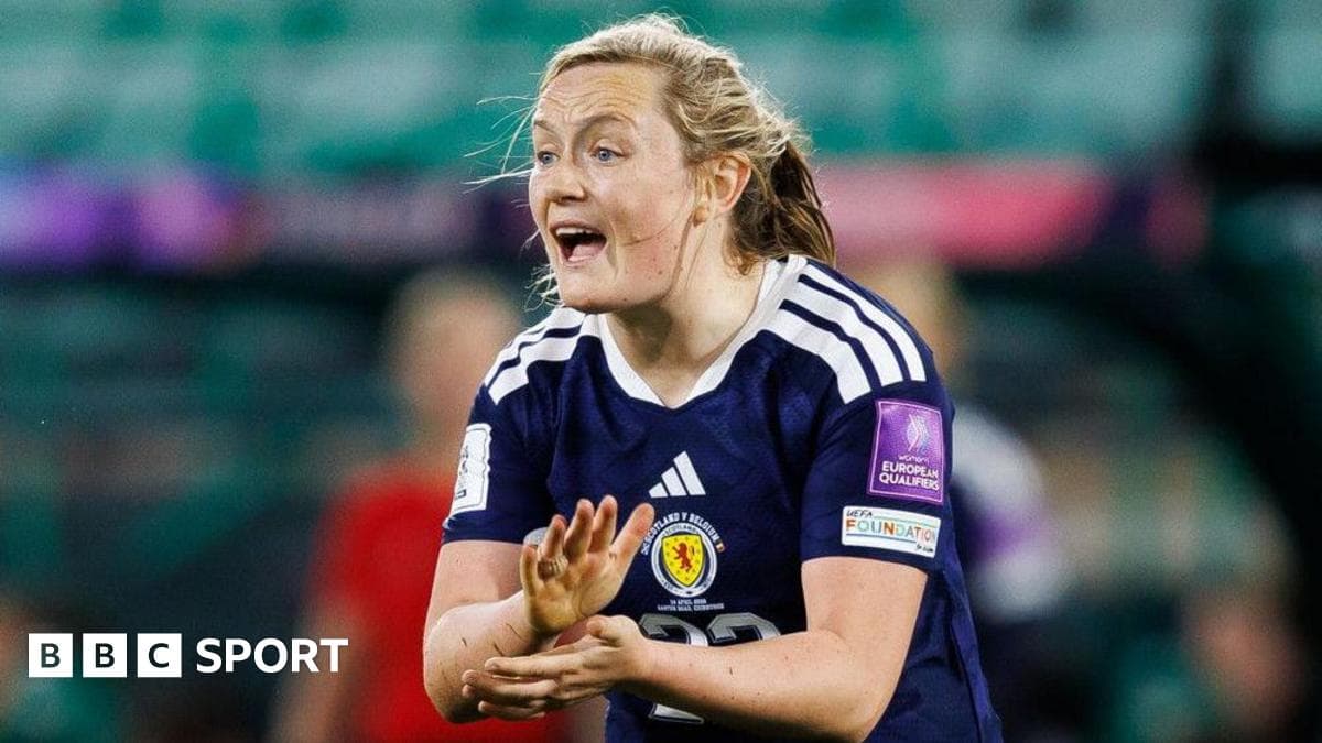 Player gesturing during women's football match