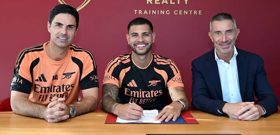 Player signing contract with club representatives at training center