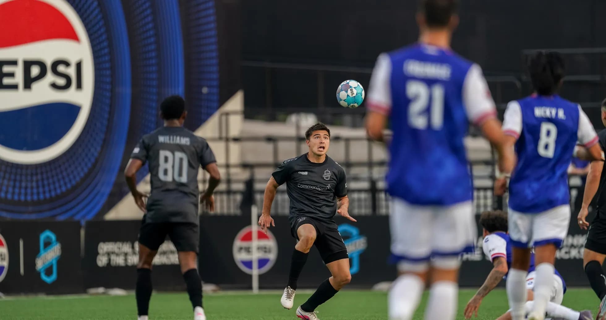 Player controlling ball during Colorado Springs match