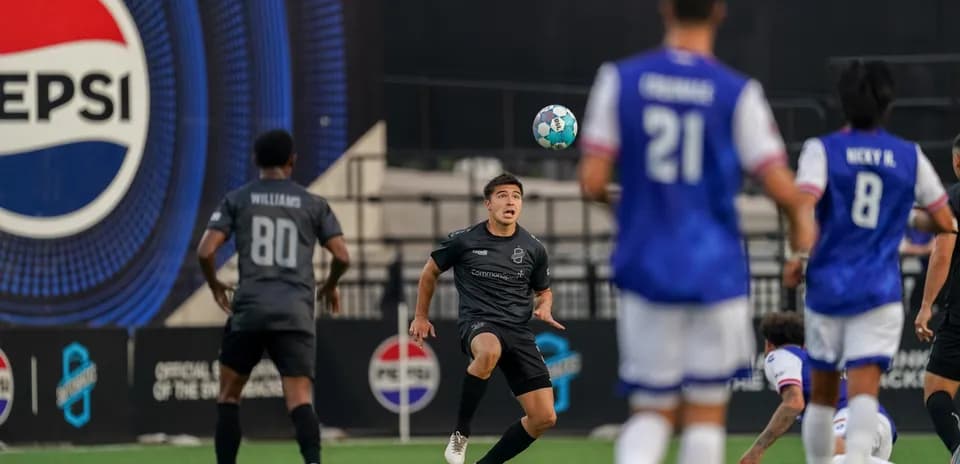 Player controlling ball during Colorado Springs match